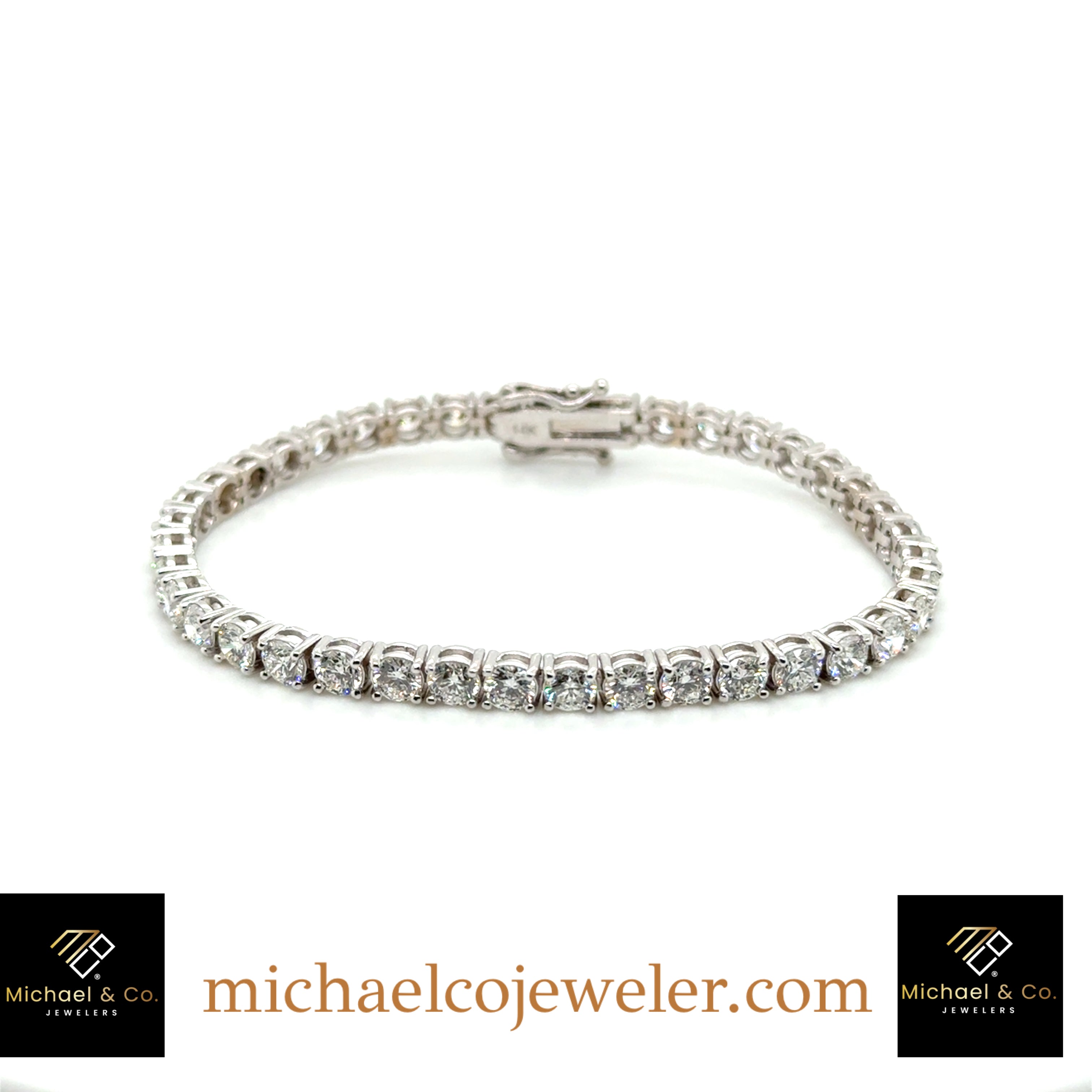 14KT white gold Tennis bracelet with natural round brilliant cut diamonds. 40RD=8.06 CT. F-G color. VS clarity. Four prongs basket setting. 6.75” 11.9gr.